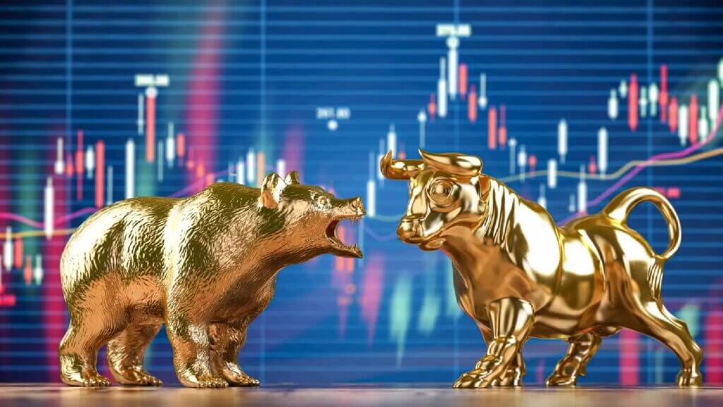 bull and bear standoff in front of a stock chart