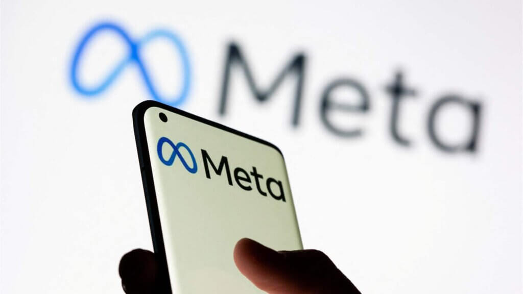 Person holding phone with Meta Platforms logo