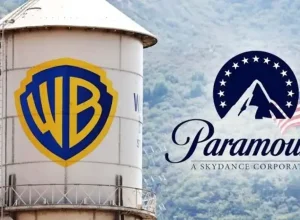 A Warner Bros logo on a water tower and a Paramount Skydance logo in the sky.