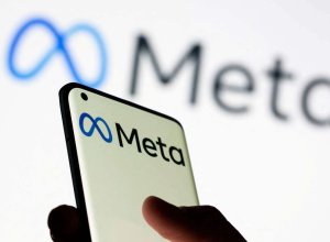 Person holding phone with Meta Platforms logo
