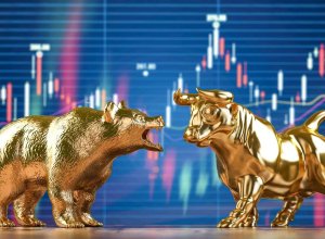 bull and bear standoff in front of a stock chart