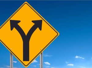 road sign showing road splitting ahead