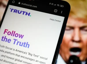 Donald Trump and a phone with Truth Social app